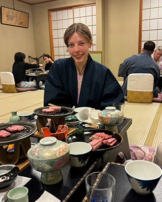 Student sitting at a traditional Japanese restaurant in Nishinomiya, Japan.