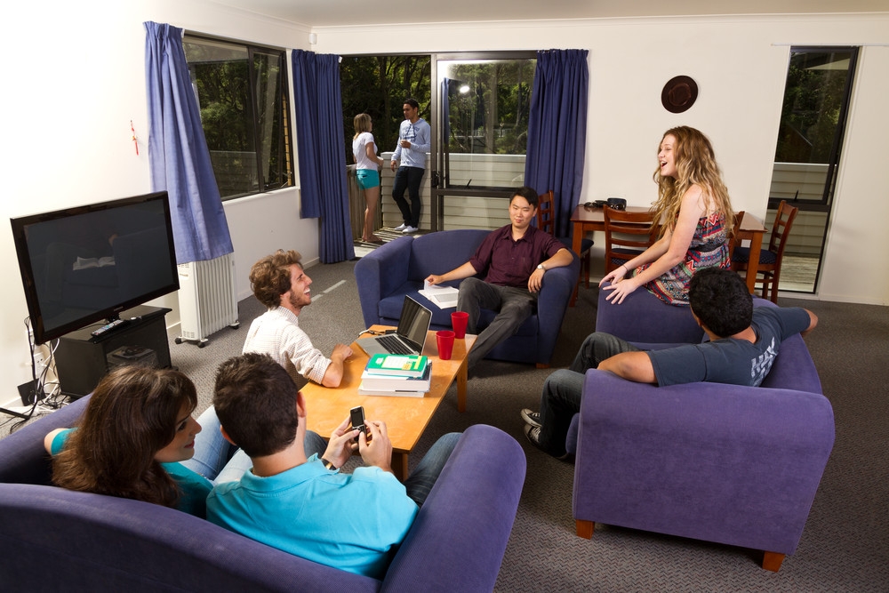 Students in the living room of the Lucas Creek housing at the Albany Campus of Massey University in Auckland, New Zealand.