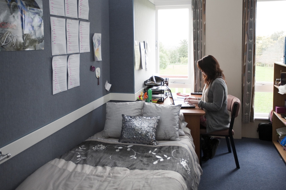 A student in a bedroom in Ferguson Hall on the Manawatu Campus of Massey University in Palmerston North, New Zealand.