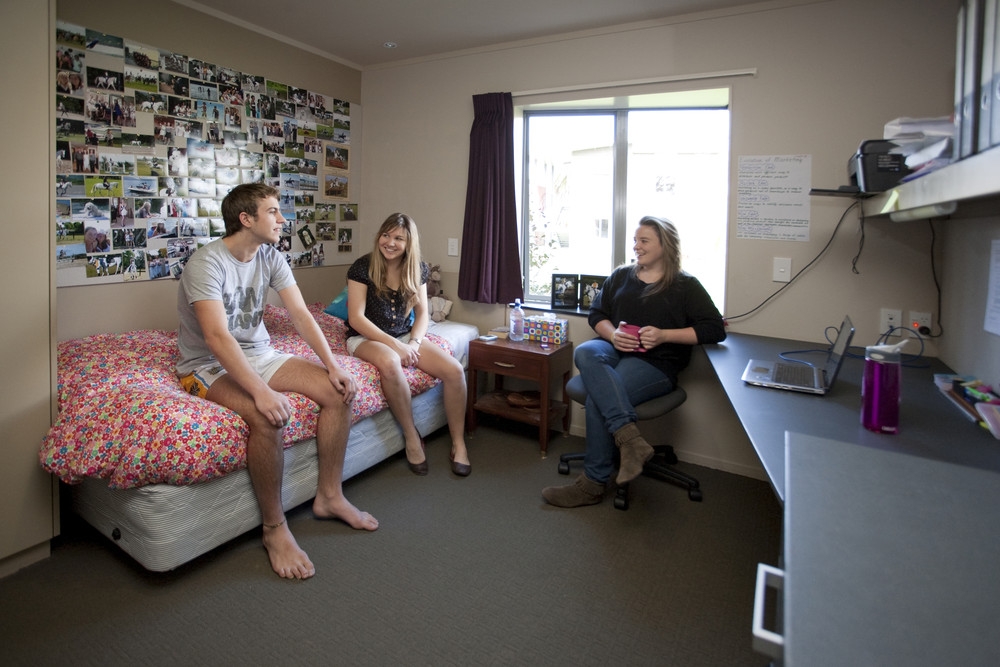 A student in a bedroom in Matai Hall on the Manawatu Campus of Massey University in Palmerston North, New Zealand.
