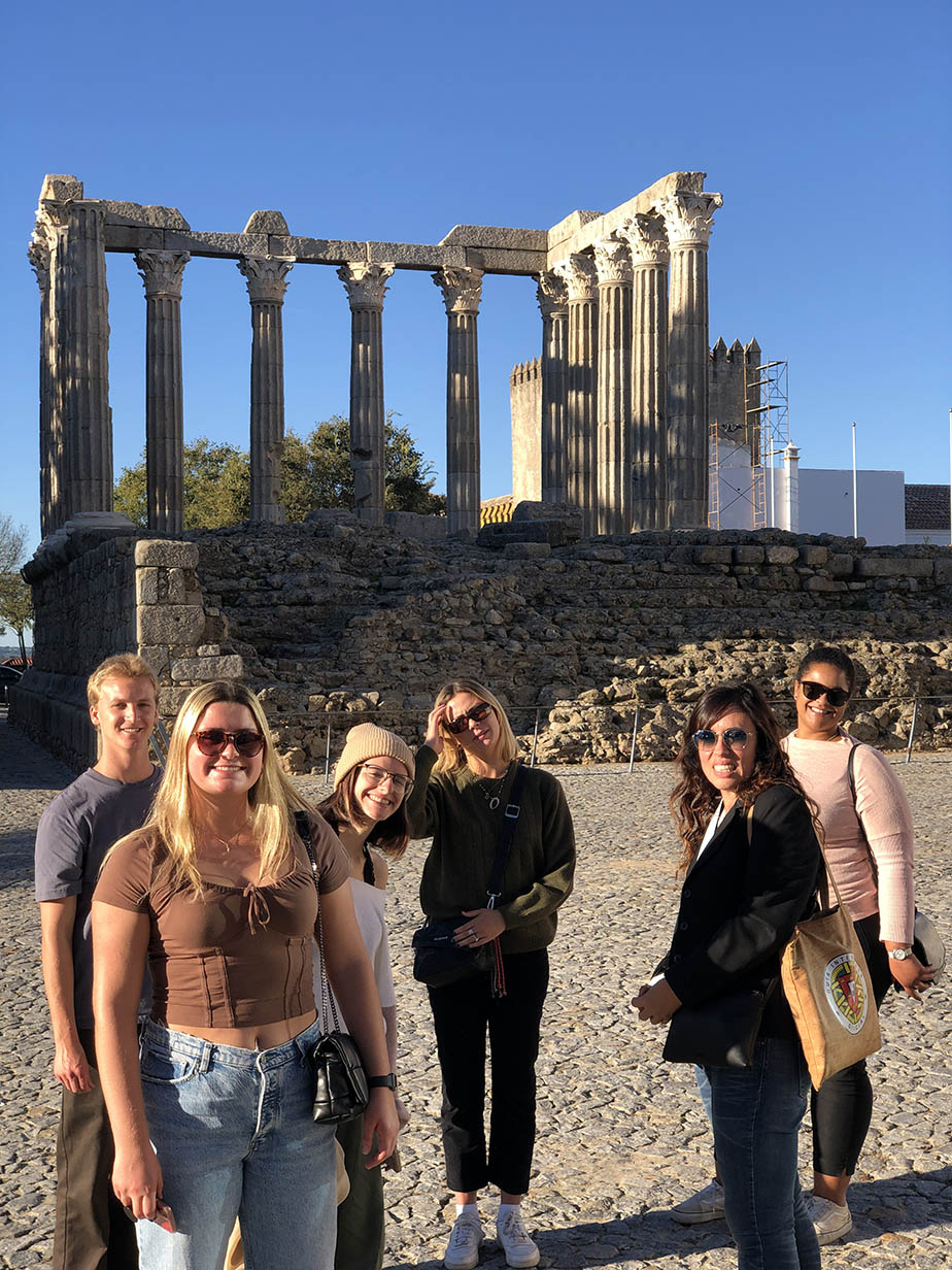 Students exploring the historic monuments of Évora, Portugal.