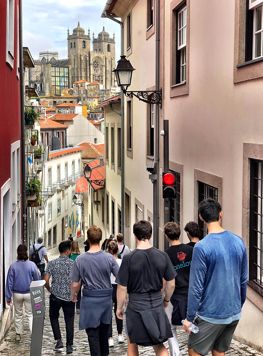 Students walking down the historic streets of Porto, Portugal.
