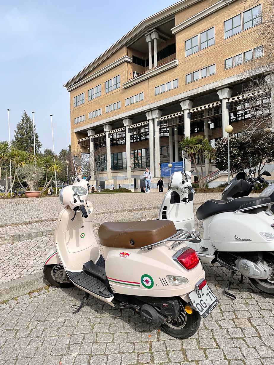 Vespas parked in front of the Universidade Católica Portuguesa in Lisbon, Portugal.