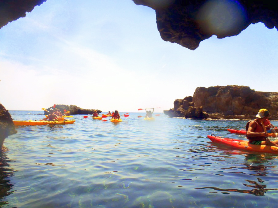 Students exploring on kayaks around tabarca Island in Spain.