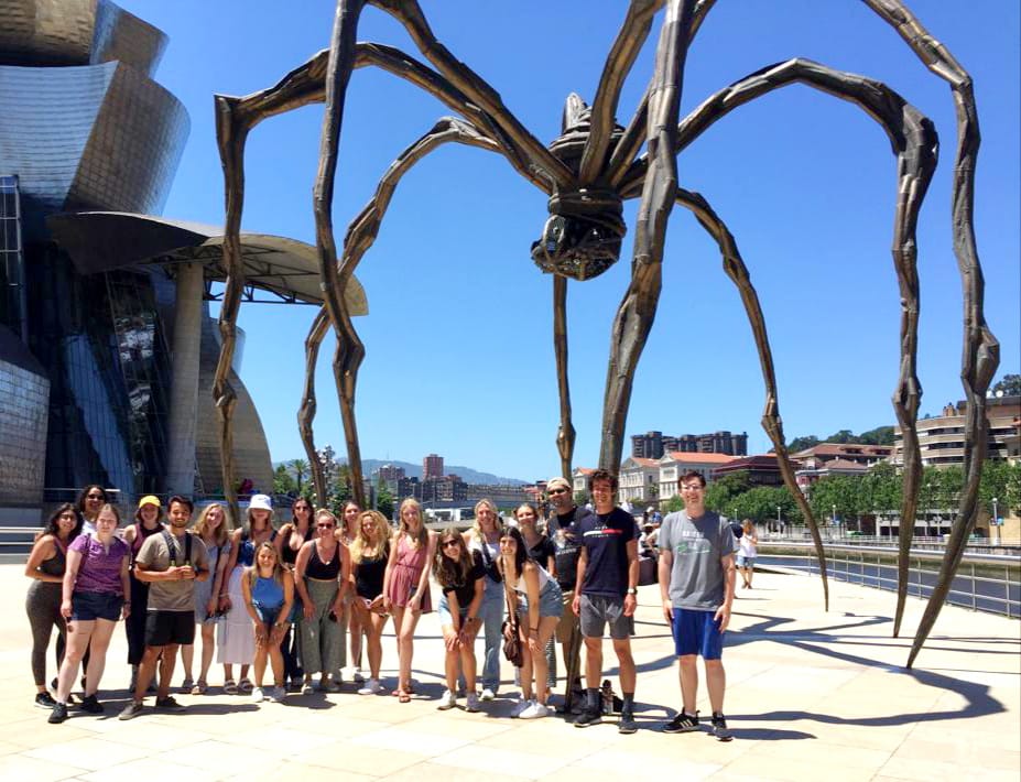 Students under a giant Salvador Dali spider sculpture outside the Guggenheim Museum in Bilbao, Spain.