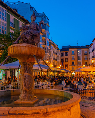 A nighttime view of the city streets in Burgos, Spain.