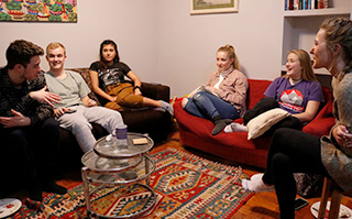 Students gathered in the living room of their shared apartment in Bilbao, Spain.
