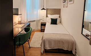 Bedroom of the shared apartment in downtown Bilbao, Spain.