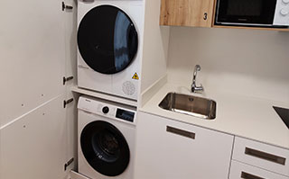 Laundry room in student apartment in downtown Bilbao, Spain.