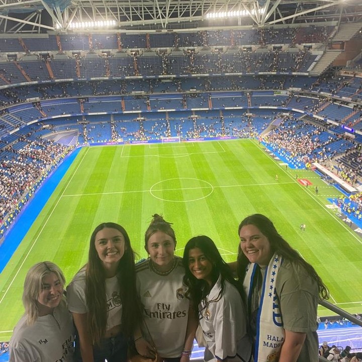 Students at a soccer match in Madrid, Spain.