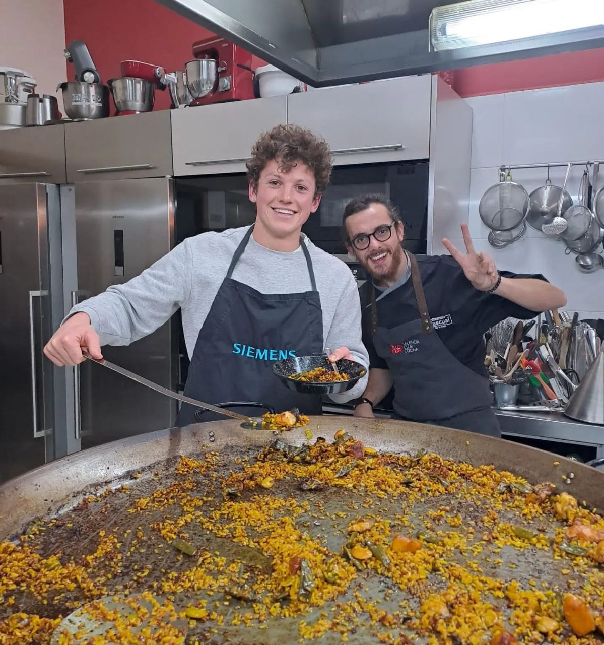 Students learning to cook paella in Valencia, Spain.