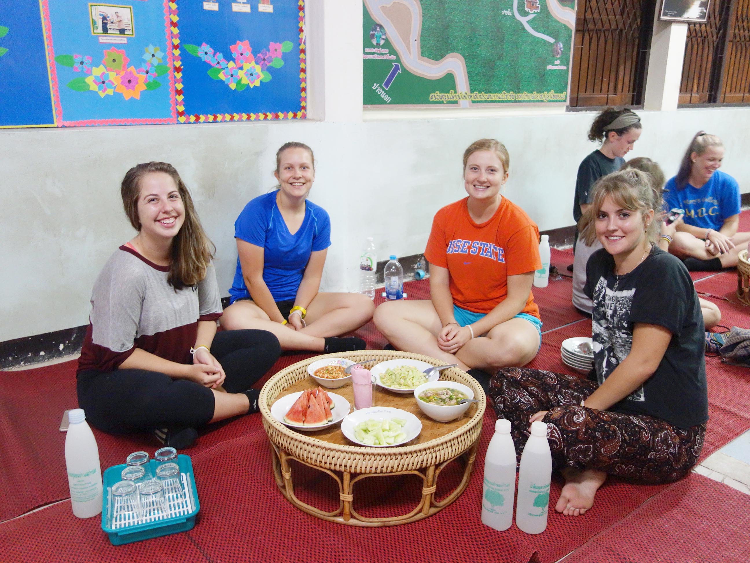 Students enjoying traditional Thai food in Mae Kampong village in northern Thailand.