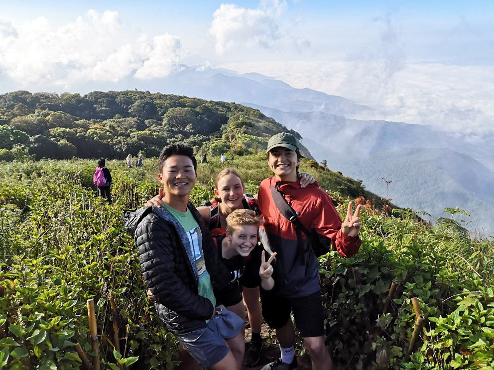 Students enjoying the view from the top of the mountain in Doi Inthanon National Park in Thailand.