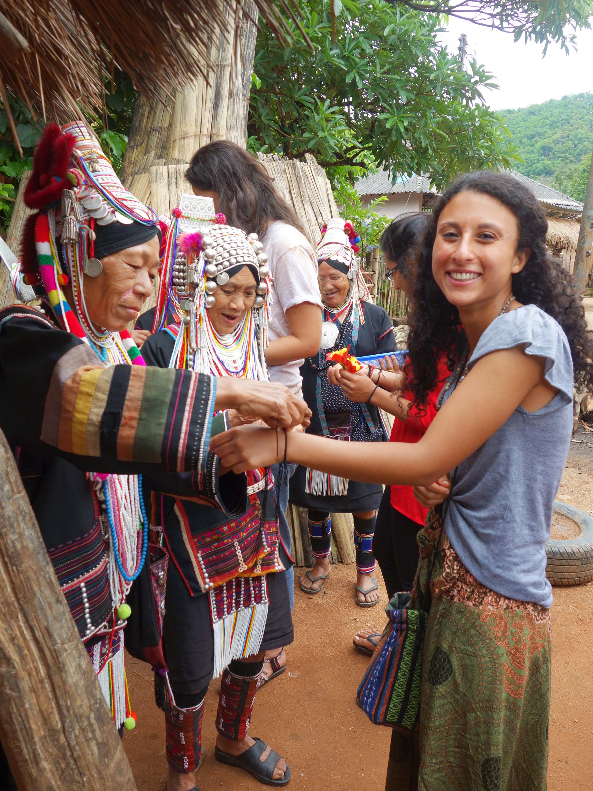A student meeting the Hmong people of the Doi Pui Hmong Village in Thailand.