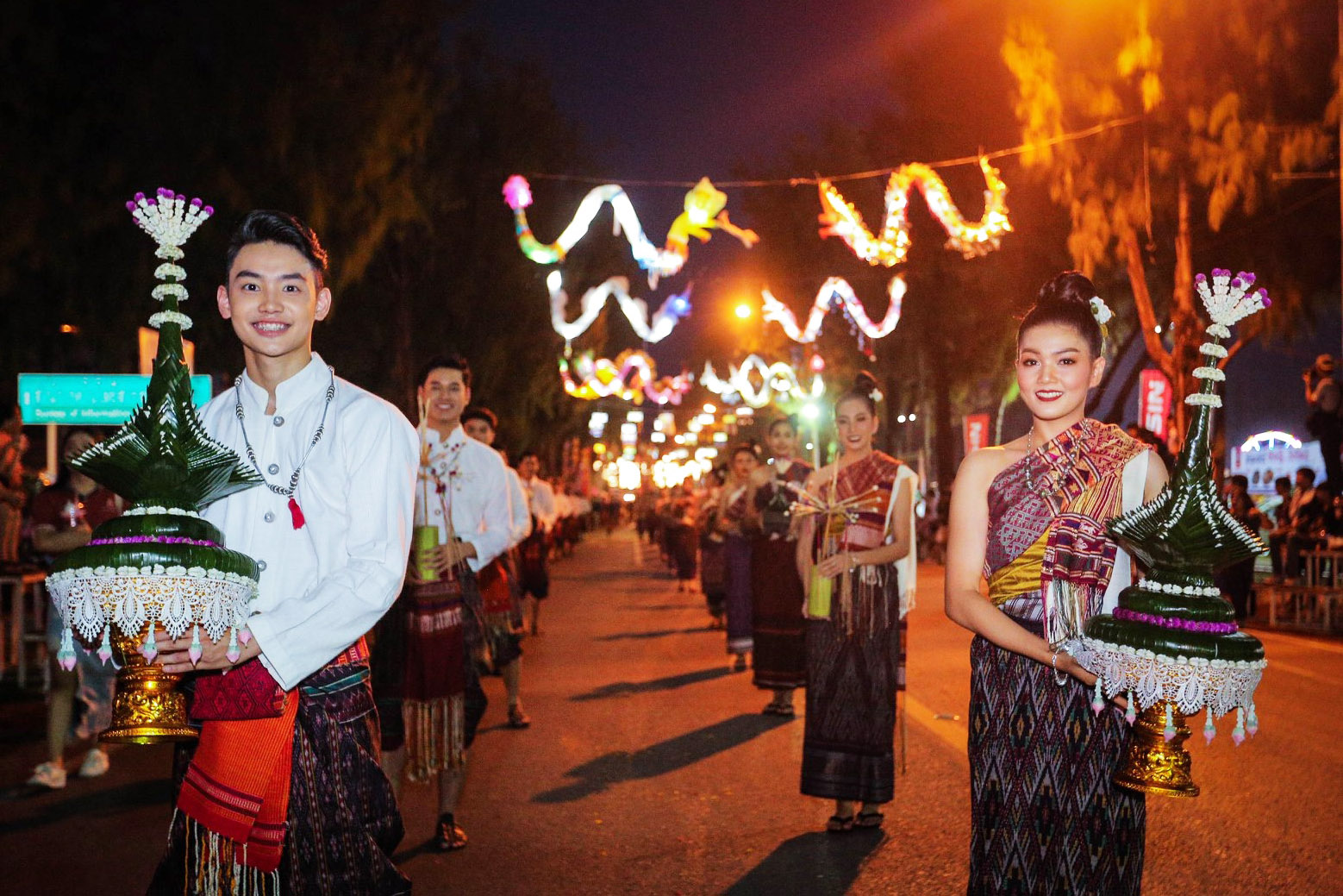 People walking in a local festival in Khon Kaen, Thailand.