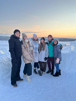 Students posing in the snow in Sweden.